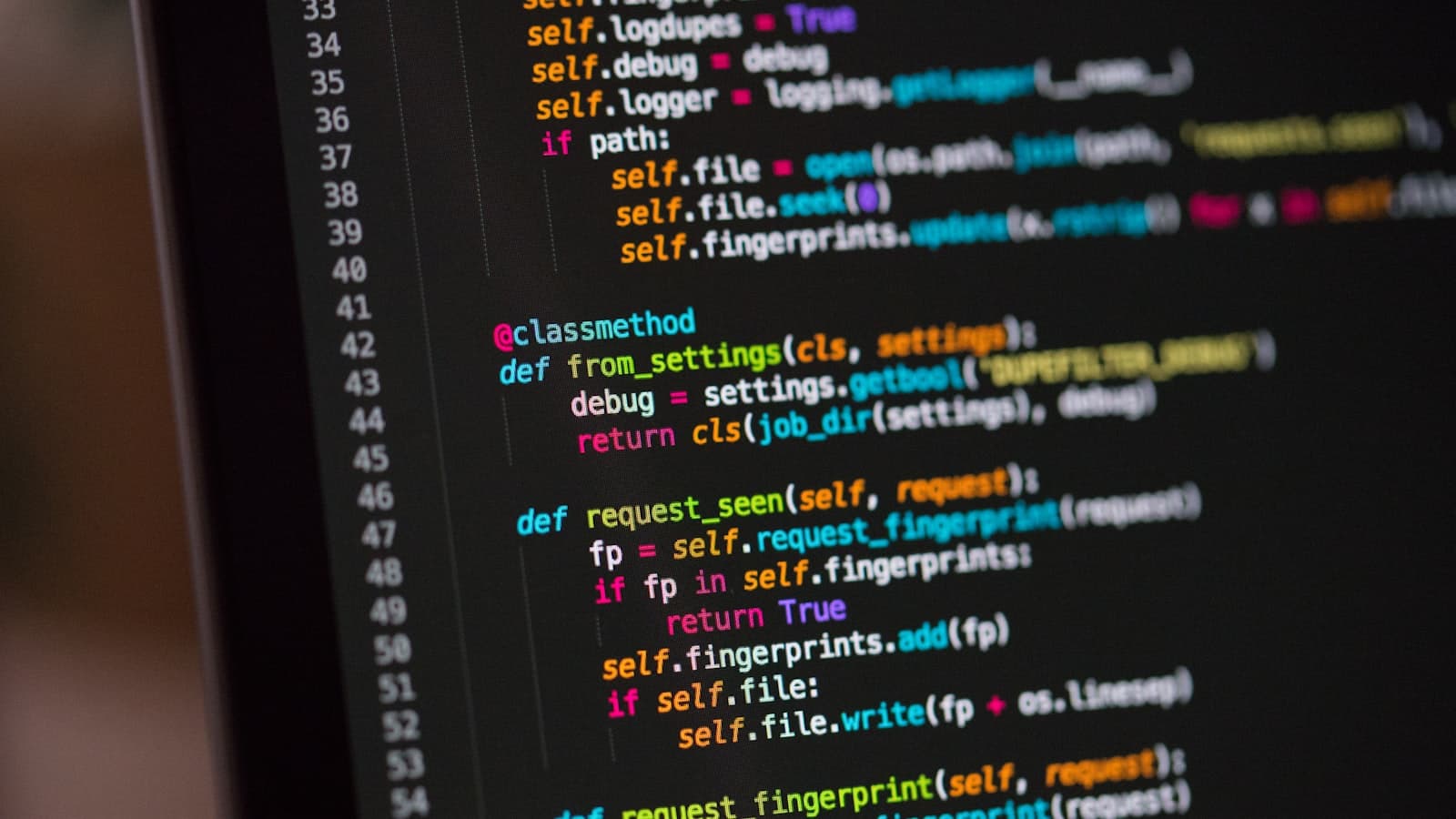 Computer monitor showing code in a focused workspace